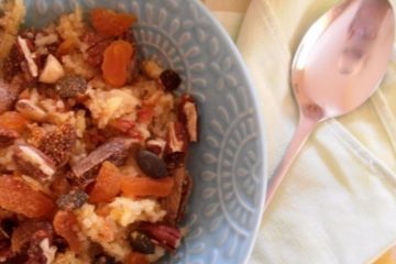 An image if Quinoa Porridge with Apples, dried figs, Apricots, nuts and seeds.
