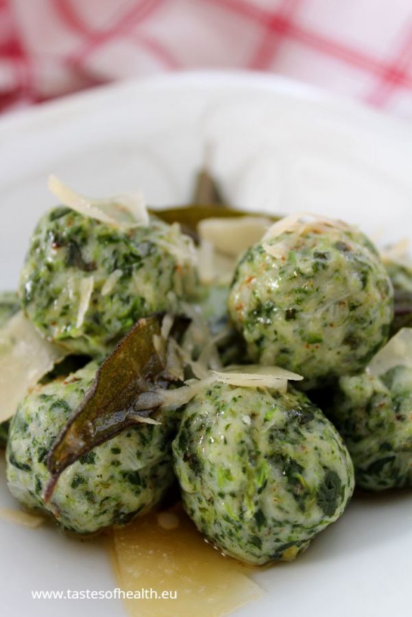 An image of a bowl of Spinach and Ricotta Gnocchi with shavings of Parmesan cheese and sage butter.