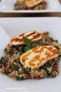 An image of Quinoa Tabbouleh with Halloumi on a white plate.