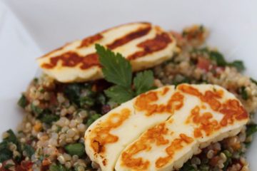An image of Quinoa Tabbouleh with Halloumi on a white plate.