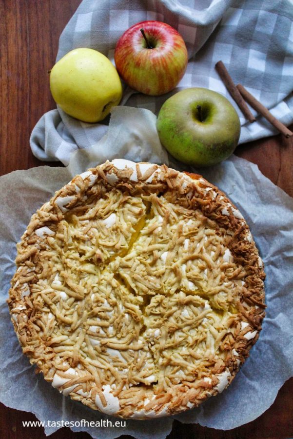 Is Healthier Baking Possible When You Want A Yummy Cake? A photo of a cake made with fat substitutes. There are 3 apples, 2 cinnamon sticks and a cloth next to the cake.