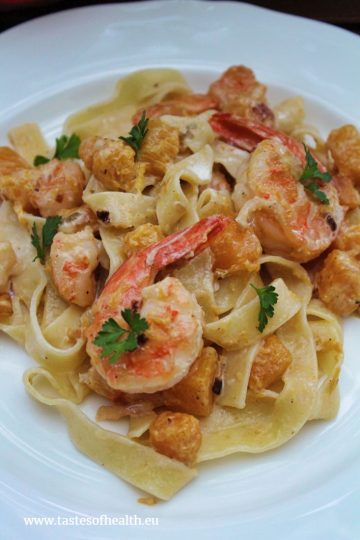 An image of Creamy Shrimp Pasta with Squash on a white plate.