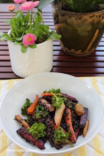 Roasted Vegetables Salad With Beluga Lentils in a white plate